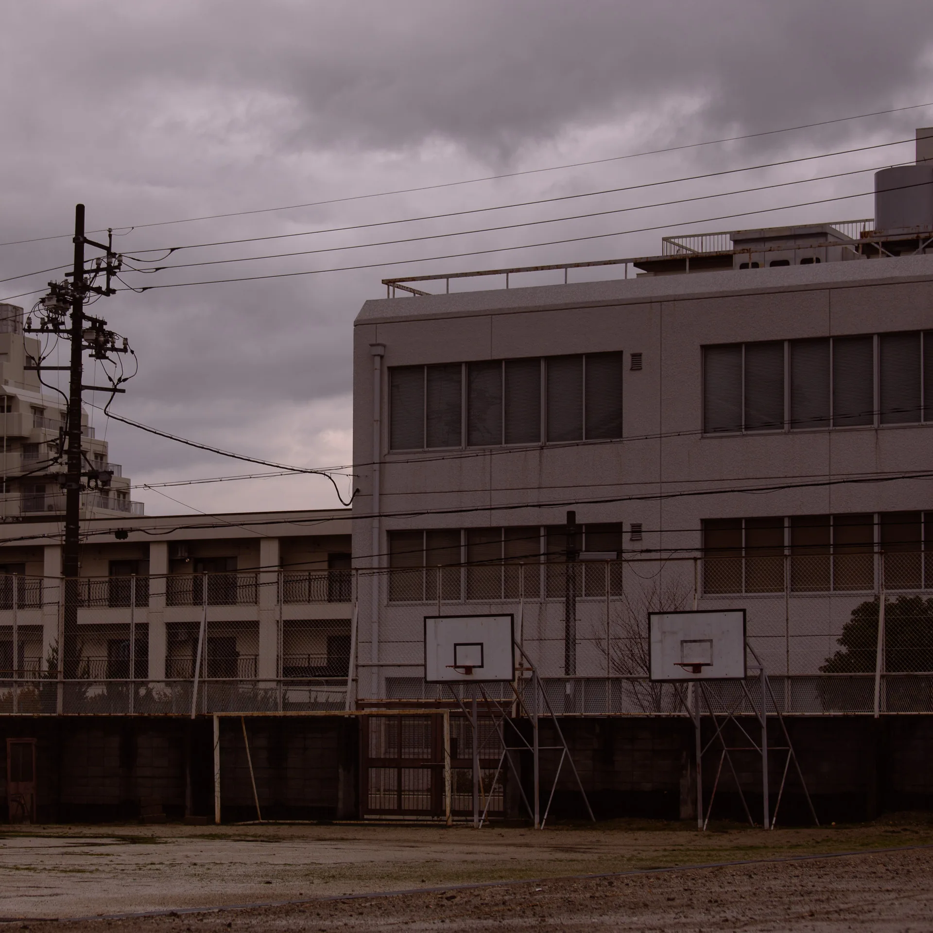 A basketball court in front of an office building