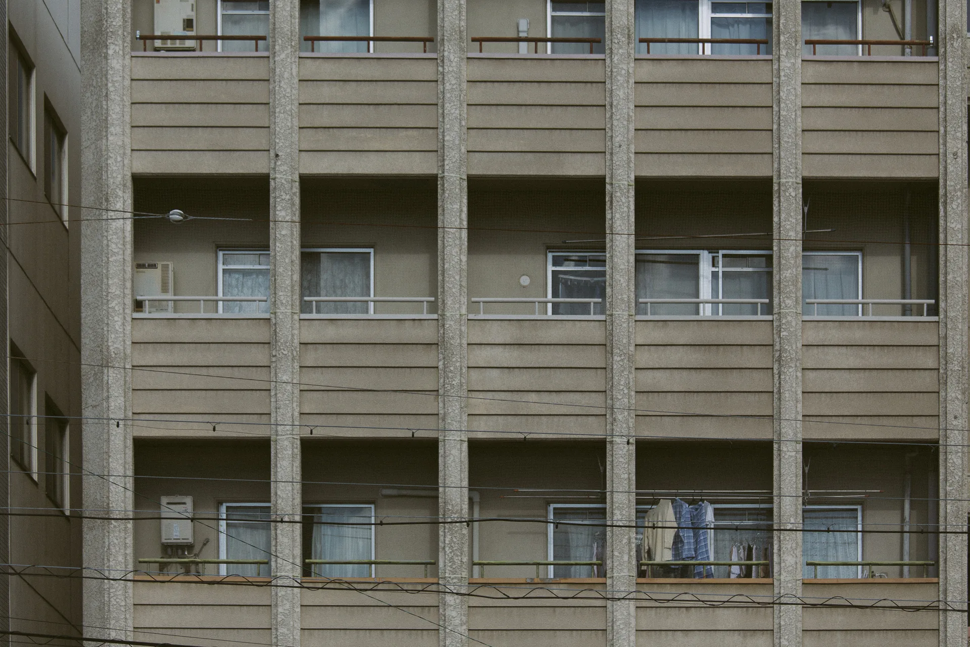 Shirts drying on the balconies of an apartment block