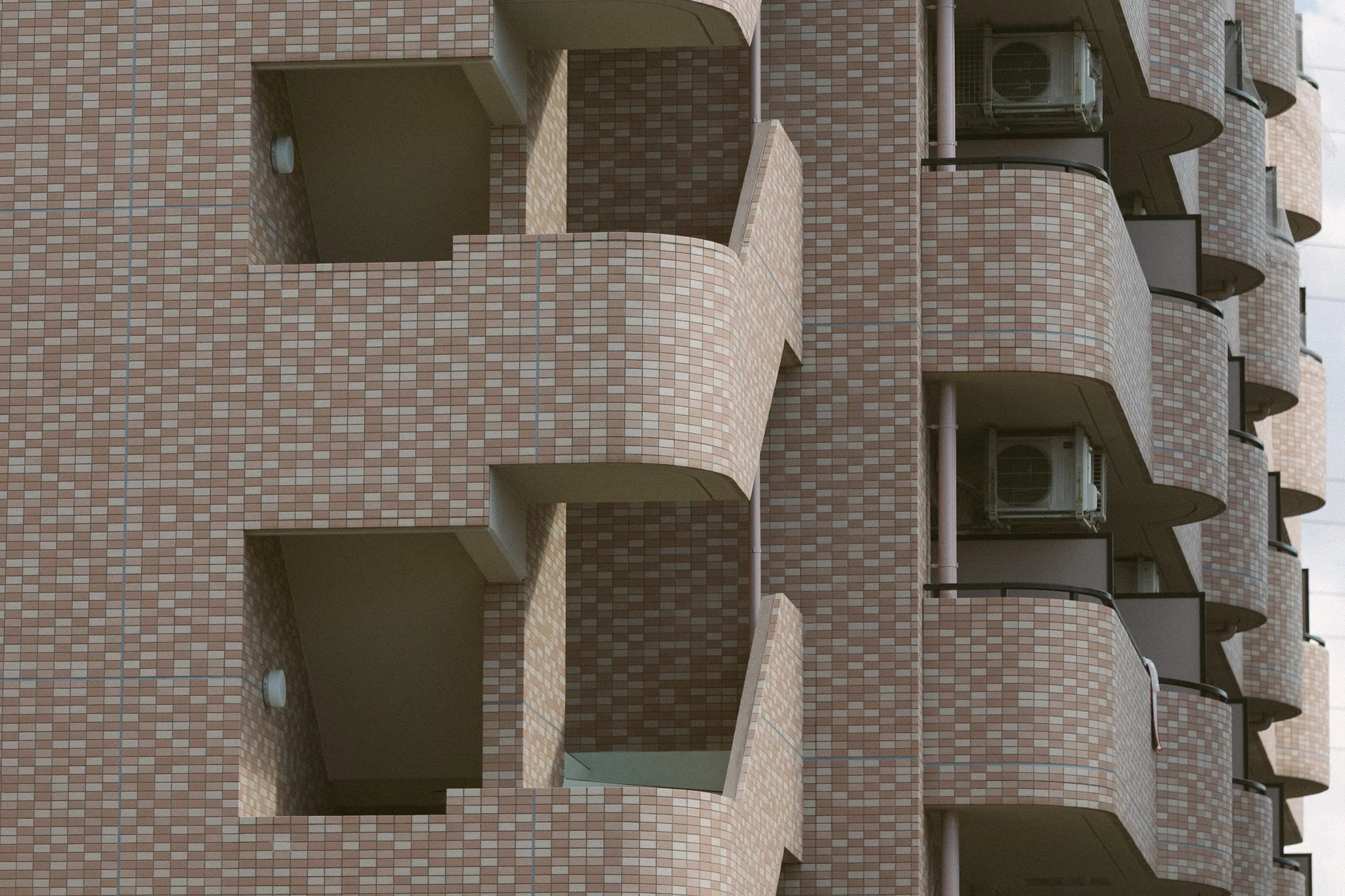 Rounded brick staircases with air conditioners