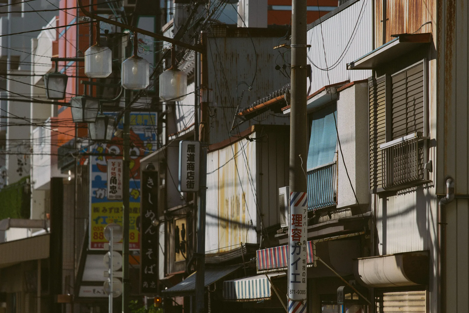 Signs, lights and buildings crowded together