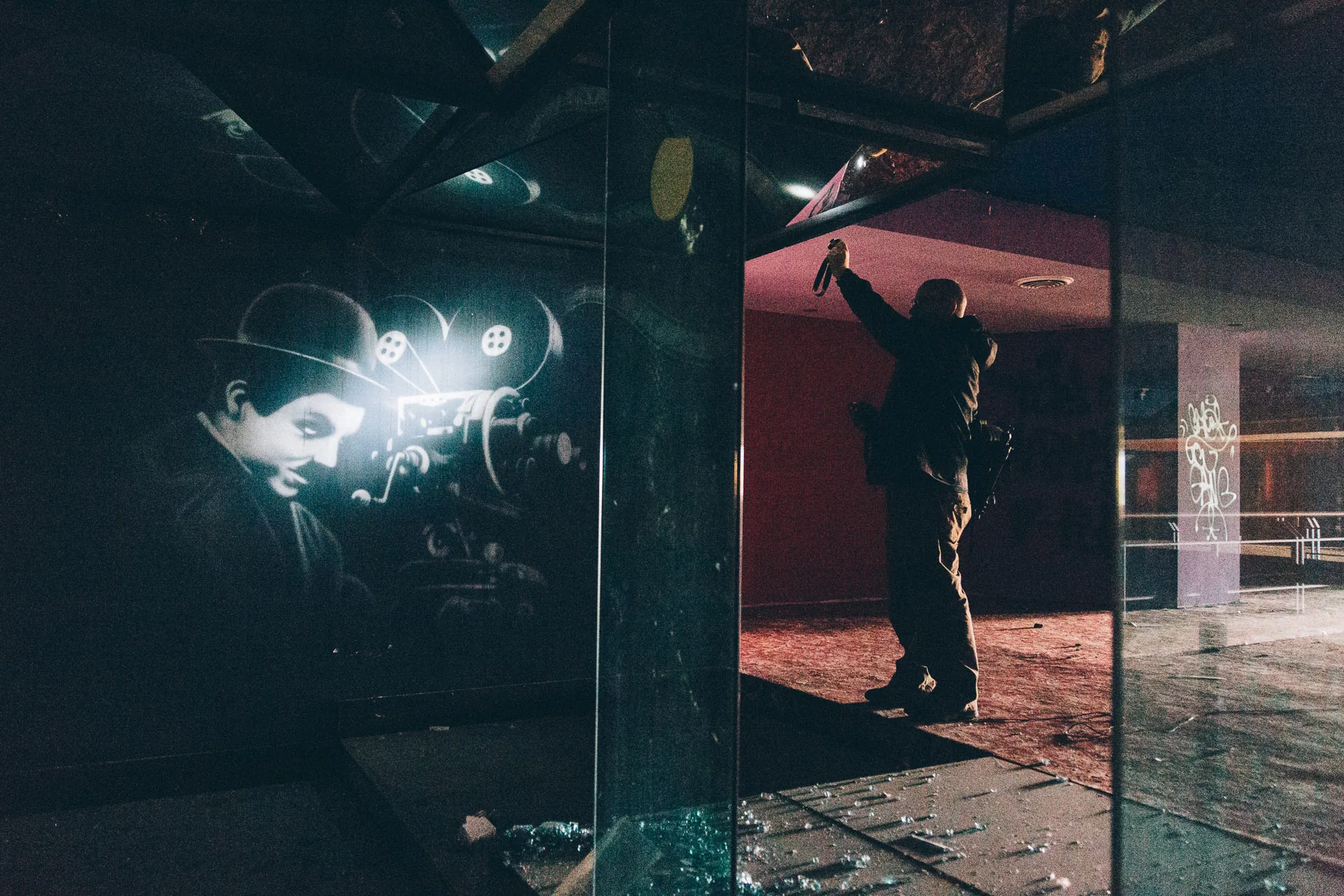 Light bursting through a broken mirror in a dark hall