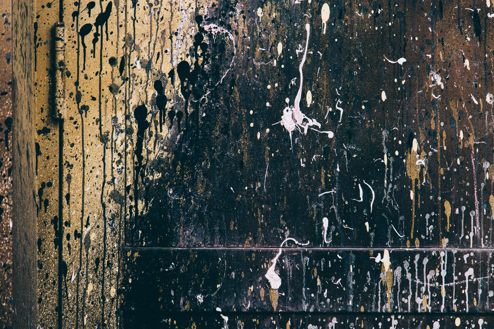 Spatters and drips on a dark wall