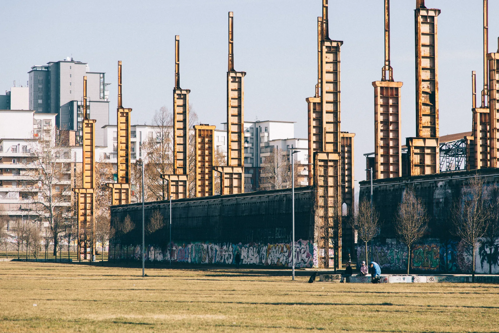 Rusted steel pylons standing in a winter field